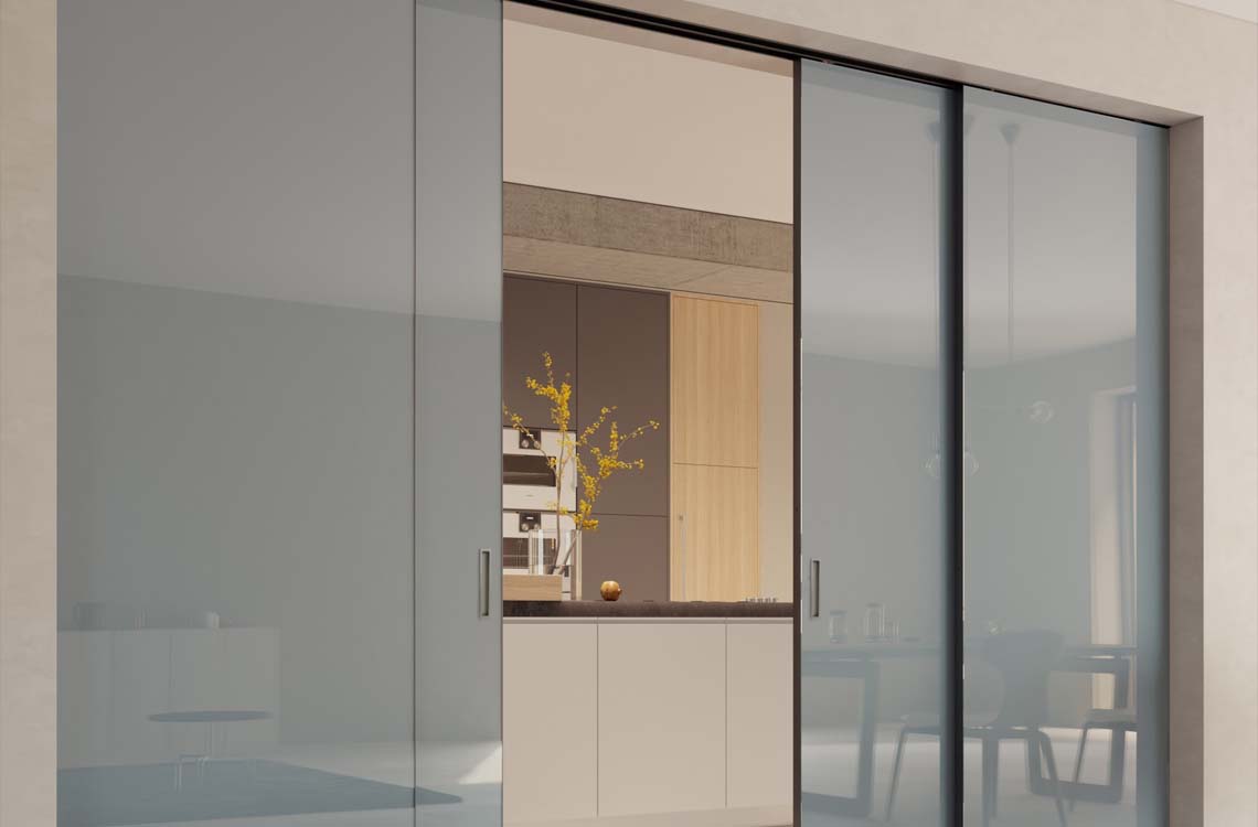 Modern frosted glass sliding room divider panels with slim dark frames in a bright interior